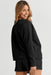 Sophisticated Black Textured Lounge Set with Long Sleeve Top and Adjustable Shorts