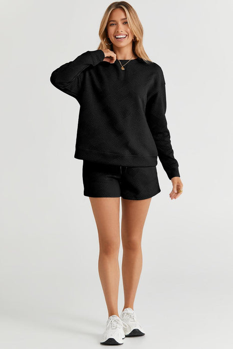 Sophisticated Black Textured Lounge Set with Long Sleeve Top and Adjustable Shorts