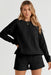 Sophisticated Black Textured Lounge Set with Long Sleeve Top and Adjustable Shorts