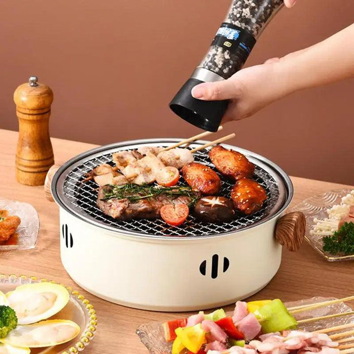 Compact Stainless Steel Charcoal Grill for Camping and Outdoor Picnics