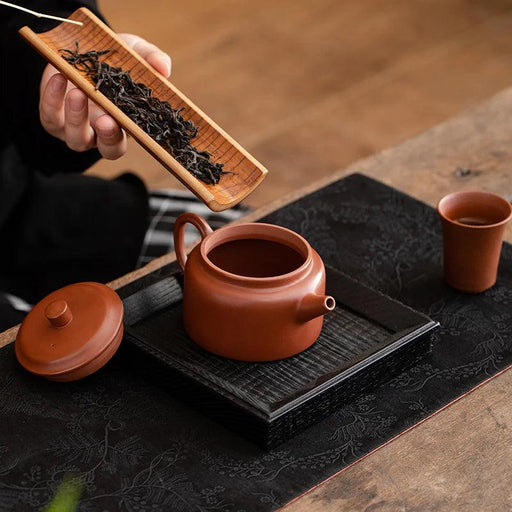 Authentic Artisan Yixing Purple Clay Teapot with Built-In Strainer for a Premium Puer Tea Experience