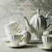 Elegant Royal 21-Piece Bone China Tea and Coffee Set with Intricate Design