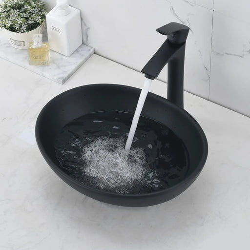 Elegant Oval Ceramic Bathroom Sink Set with Black Faucet and Stainless Steel Drain