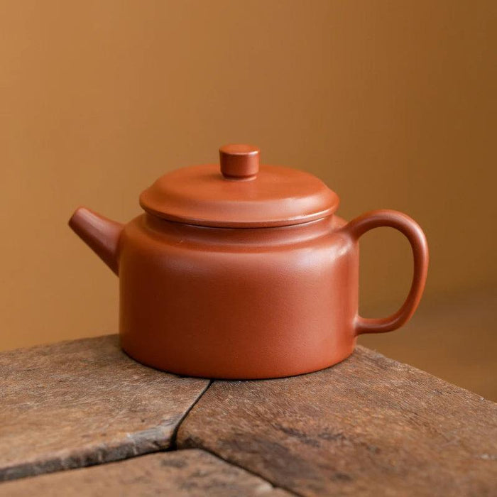 Authentic Artisan Yixing Purple Clay Teapot with Built-In Strainer for a Premium Puer Tea Experience