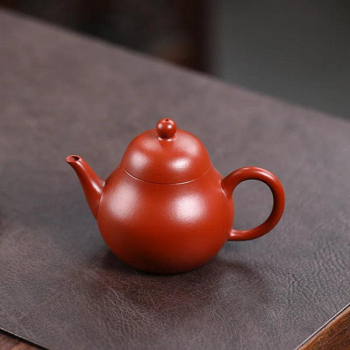 Elegant Purple Clay Teapot with Golden Accents for Refined Tea Enjoyment