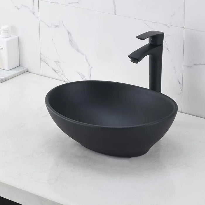 Elegant Oval Ceramic Sink Ensemble with Black Faucet and Stainless Steel Drain