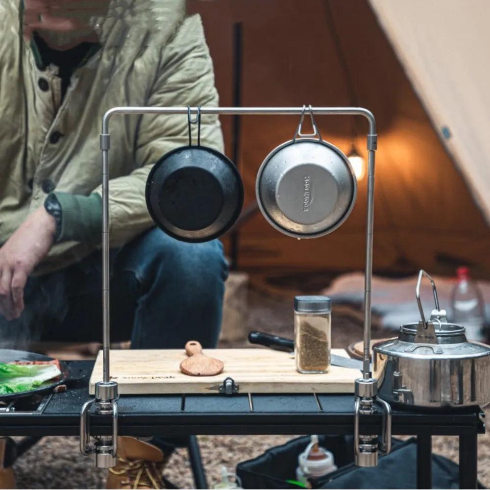 All-in-One Stainless Steel Camping Organizer with Integrated Light Stand and Storage Solutions