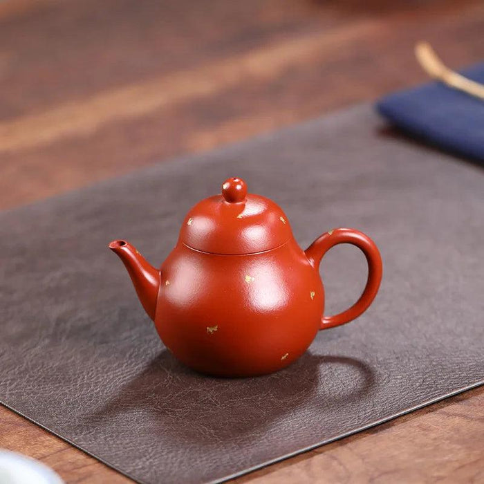 Elegant Purple Clay Teapot with Golden Accents for Refined Tea Enjoyment