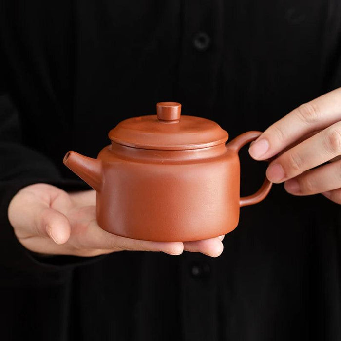 Authentic Artisan Yixing Purple Clay Teapot with Built-In Strainer for a Premium Puer Tea Experience