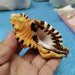 Vibrant Yellow-Orange Triton Conch Shell with Unique Black Patterns for Aquatic Decor and Photography