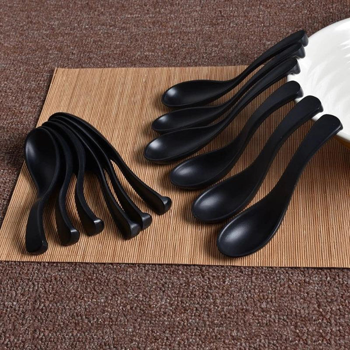 Sophisticated Black Melamine Serving Spoon with Elegant Japanese Porcelain Motif