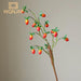 Festive Red Pomegranate Floral Branch with Lush Greenery