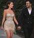 Elegant Champagne Strapless Gown with Crystal Accents and Trendy Tassels