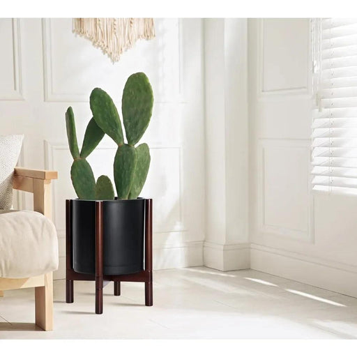 Contemporary 12-Inch Matte Black Planter with Sculptural Wood Stand for Stylish Indoor Plants