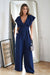 Chic Wide-Leg Jumpsuit with Flared Sleeves and Statement Belt