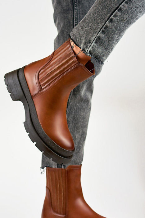 Sleek Eco-Friendly Black Leather Ankle Boots for Effortless Style