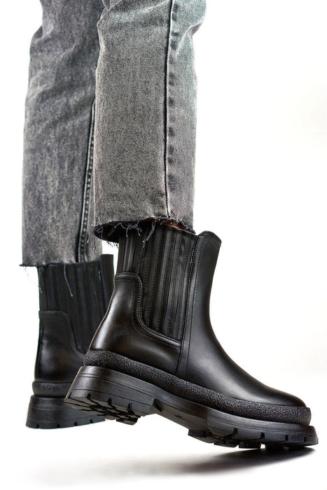 Sleek Eco-Friendly Black Leather Ankle Boots for Effortless Style