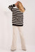 Sophisticated Striped Ribbed Knit Outfit with High-Waisted Trousers