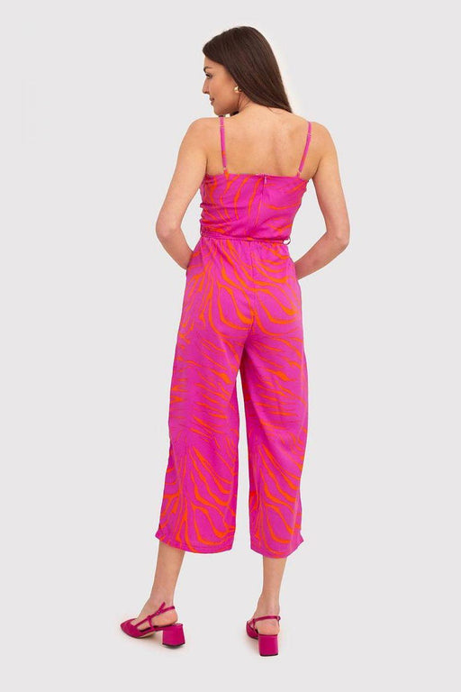 Chic Strapless Jumpsuit with Envelope Top in Vibrant Pink and Orange Print