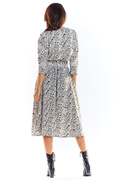 Chic Midi Dress with Stylish Prints and Complementary Waist Belt