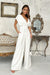 Chic Wide-Leg Jumpsuit with Flared Sleeves and Statement Belt