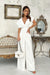 Chic Wide-Leg Jumpsuit with Flared Sleeves and Statement Belt