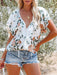 Relaxed Blooms | Women's loose-fit floral print v-neck top with short sleeves