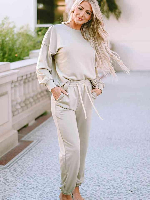 Cozy Chic Lounge Ensemble with Trendy Drop Shoulder Top and Convenient Pocketed Pants