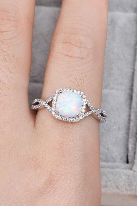 Opulent Opal Crisscross Ring with Elegant Accents