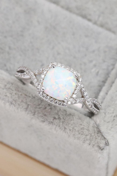 Opulent Opal Crisscross Ring with Elegant Accents