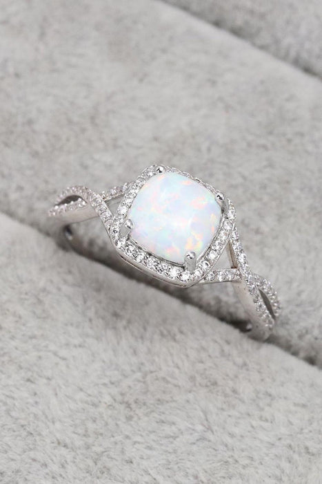 Opulent Opal Crisscross Ring with Elegant Accents