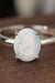 Opulent Opal Solitaire Ring: Exquisite Silver with Luxurious Platinum Coating